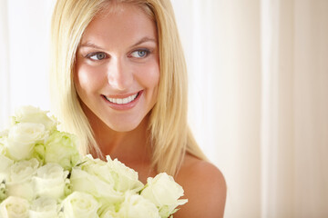 Obraz na płótnie Canvas Face, smile or thinking and woman with flowers closeup in her home for romance on valentines day. Beauty, rose bouquet and a happy young blonde woman in her apartment for anniversary celebration