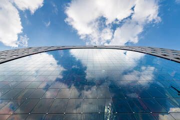 View of the sky reflected on the window of the MARKTHAL covered market, Rotterdam, Holland, The...