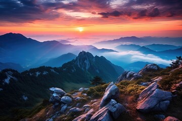 Captivating image showcasing the awe-inspiring beauty of the setting sun casting its warm glow over a magnificent mountain range., Mountain top landscape view with clouds at sunset, AI Generated