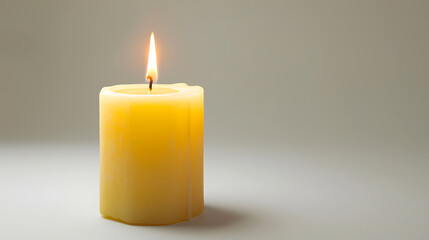 Fototapeta na wymiar Burning wax candle, isolated on a one-tone background