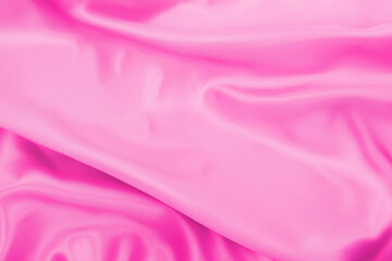 Plastic pink satin fabric texture soft blur background