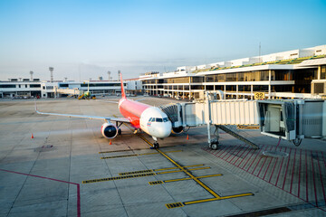 The plane is ready to depart. Airplane bridge picks up passengers for travel at the apron.