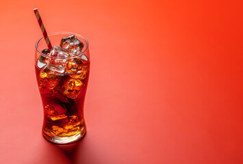Refreshing glass of cola with ice