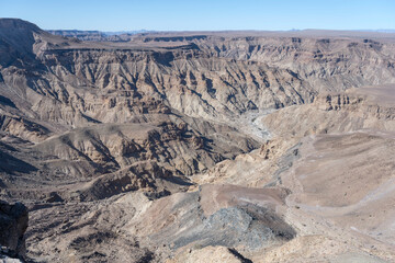 worn  escarpment slopes and meandering dry riverbed from Hiker viewpoint, Fish River Canyon, ...