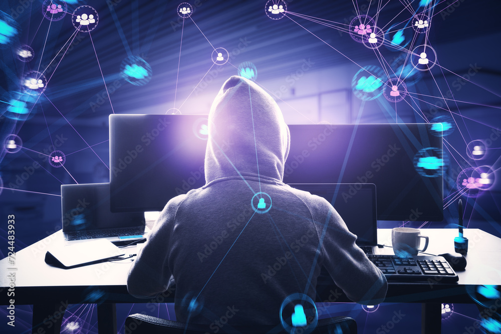 Poster Back view of hacker in hoodie using computers at desk with connected digital people team icons on dark blurry purple office interior background. Digital network, community and social media concept.