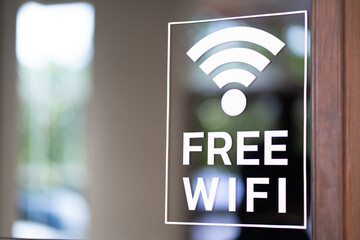 Free wifi icon symbol, wifi signal with wave signal icon on glass background in cafe shop