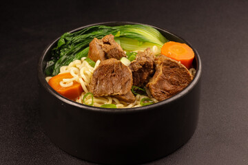 Taiwanese Beef Noodle Soup with Bok Choy and Carrot.