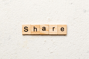 share word written on wood block. share text on table, concept