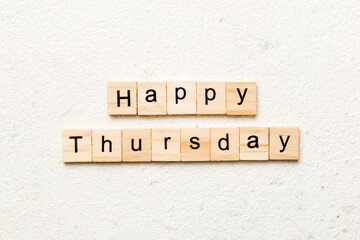 Happy thursday word written on wood block. Happy thursday text on cement table for your desing,...
