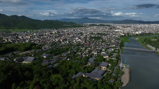 Aerial pan shot of the Sagatenryuji Susukinobabacho area, summer in Kyoto, Japan