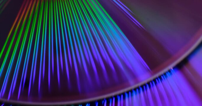 Reflection of the surface of a DVD discs with artistic lighting close-up