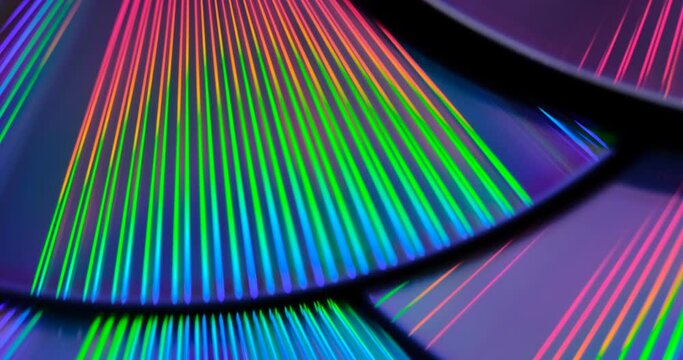 Reflection of the surface of a DVD discs with artistic lighting close-up