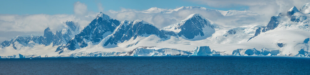 Wide parorama of the mountain range of the Antarctic peninsula, Paradise Bay, Gerlach Straight, Antarctic mainland.