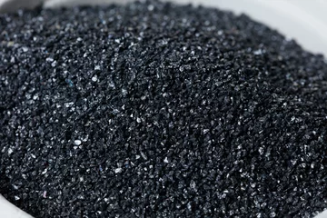 Fotobehang Macro close up of Silicon Carbide black sand size. Fine particle silicon carbide pile up, White background Isolated, particle element object © Jade
