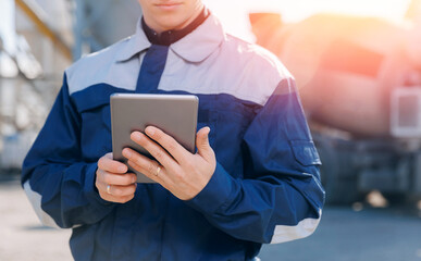 Concept banner automated logistics online internet. Dump truck driver man in uniform with tablet...