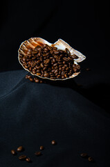 Coffee beans beautifully scattered on a black background