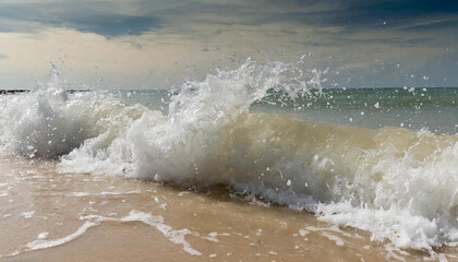 Fototapeta premium hard wave water hit sand in close up at beach