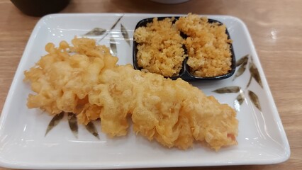 Shrimp tempura served on a plate. Tempura is a Japanese food. It is Japanese fried shrimp.