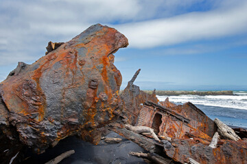  S.S. Waitangi shipwreck. Rusty shipwreck at Mana Bay New Zealand. Patea. Taranaki. Tasman Sea....