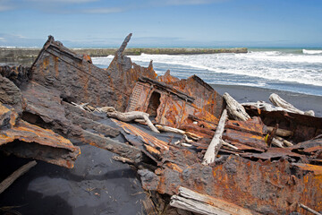  S.S. Waitangi shipwreck. Rusty shipwreck at Mana Bay New Zealand. Patea. Taranaki. Tasman Sea....