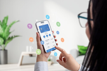 Woman hold a smartphone with a fintech app, surrounded by concept balloons featuring fintech service icons. Dynamic visuals embody modern financial technology in a user-friendly interface