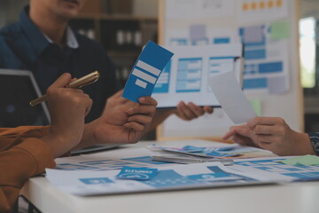 Close up ux developer and ui designer use augmented reality brainstorming about mobile app...