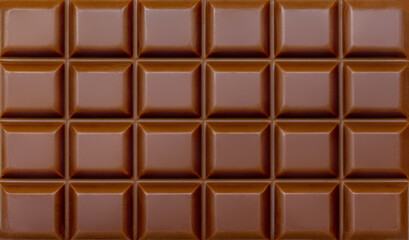 Milk chocolate bar textured background. Chocolate Pattern.   High resolution image close up.
