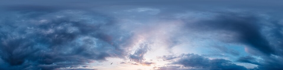 Dramatic Sunset sky 360 panorama. Vibrant sky panorama with bright glowing red pink Cumulus clouds. HDR 360 seamless spherical panorama. Sky dome for aerial drone panoramas. Climate and weather change