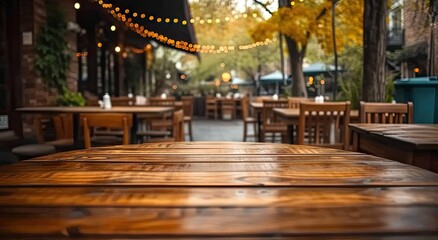 Elegant wooden table in restaurant with blurred bokeh background. Vintage cafe ambiance with cozy interior design. Abstract business setting in pub with retro decoration perfect for dining
