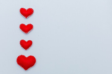 Red felt diy homemade hearts couple isolated on white background. Valentine day mockup. Lovers holiday symbols.