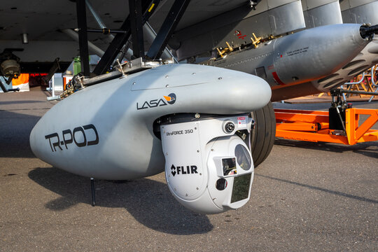 UltraForce 350 multi-Sensor surveillance pod under an airplane. 