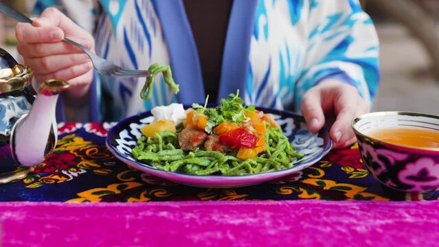 Shivit osh or Khorezm lagman green noodles Uzbek dish