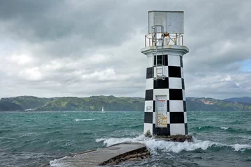 Fotobehang Lighthouse at Halswell point. Wellington New Zealand. Bay. Sea. Coast. © A