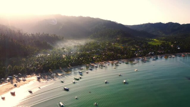 Aerial view over Port Barton Harbour in Palawan, the Philippines, on a sunny morning. blue seas and skies.