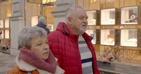 Elderly Explorers Strolling Through City, Capturing Real Life and Shopfronts During Travel. Senior...