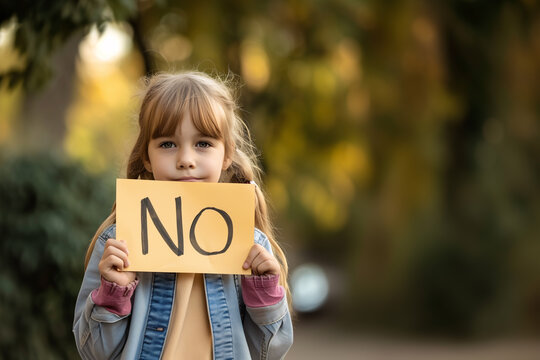 Girl holding a sign saying "No, to abuse, mistreatment, corruption of children, violence".