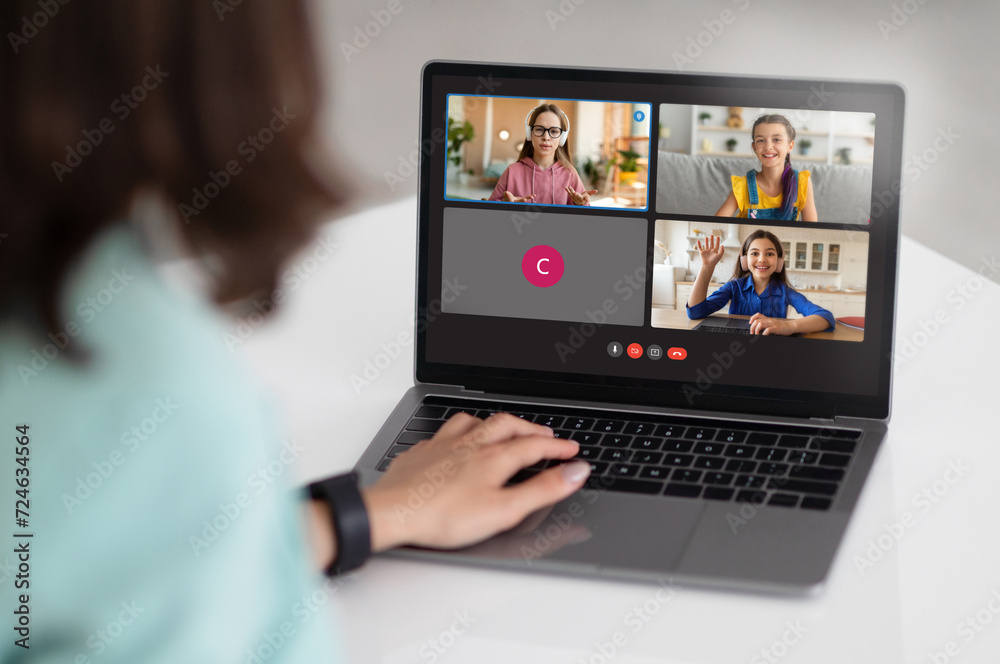 Poster Teacher with computer having video conference chat with class