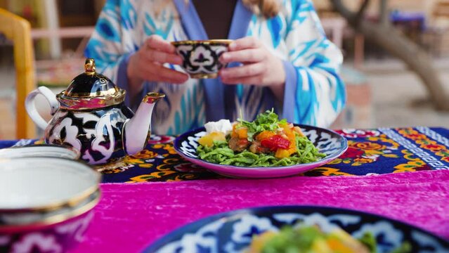 Shivit osh or Khorezm lagman green noodles Uzbek dish