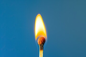 Blue background with matchstick and flaming head - obrazy, fototapety, plakaty