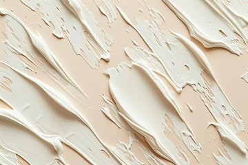 Creamy cosmetic smears on a beige backdrop