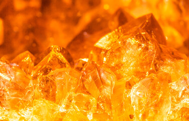 Golden crystal mineral stone. Gems. Mineral crystals in the natural environment. Texture of precious and semiprecious stones. Seamless background with copy space.