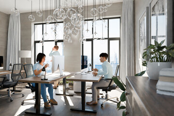 modern office with team of it professionals; with floor-to-ceiling windows and panoramic view; modern minimalistic interior design of workspace, top down view, bright daylight; 3D rendering