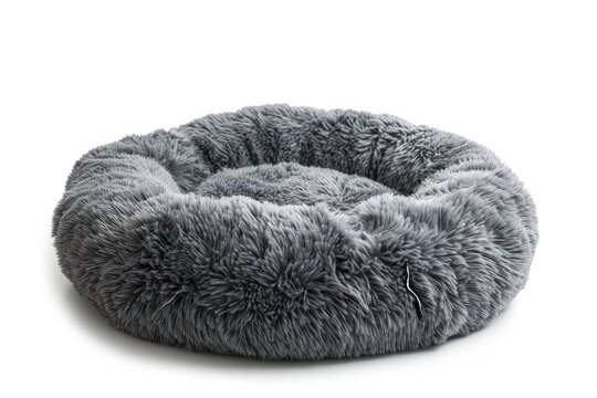 Plush pet bed in round shape soft and grey on a white background
