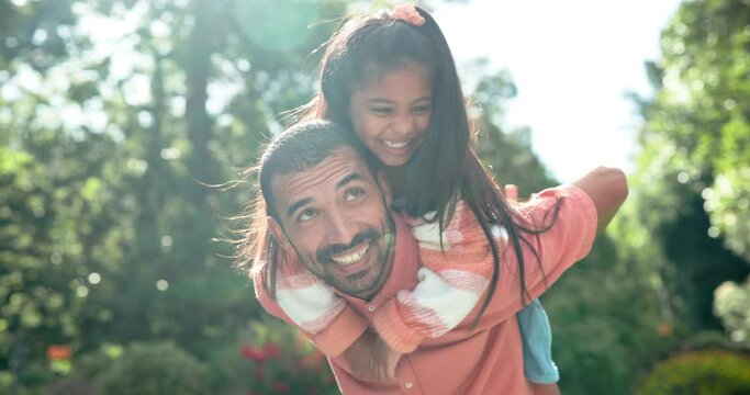 Happy father, girl and piggyback outdoor with games, fun in the sun and excited for bonding, love and support. Mexican dad, family or parent playing with child in nature, garden or park for adventure