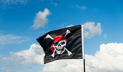 Pirate flag waving on sky