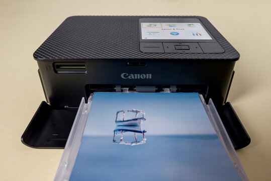 Antalya, Turkey - January 31, 2024: Canon Selphy CP1500 mobile photo printer on yellow background