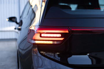 Close up detail on one of the LED red taillight modern luxury car. Exterior detail automobile. Car...