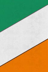 Paper cut in colours of the flag of Ireland. Illustration for Saint Patrick Day.