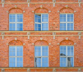 Fototapeta na wymiar Beautiful architecture of the old town in Gdansk. Close-up with details. Bright facades of buildings. View of the Old Town. A walk through the city on a sunny summer day