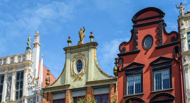 Facade of beautiful typical colorful houses on Dluga street (Dlugi Targ square) in old historical town centre on a sunny summer day, Gdansk, Poland